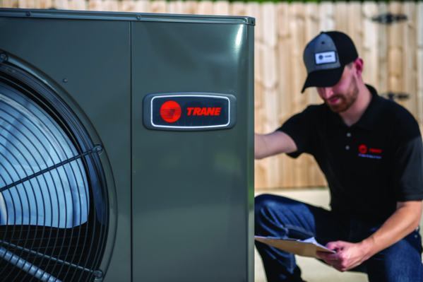 Comfort Control technician is working on a trane air conditioner