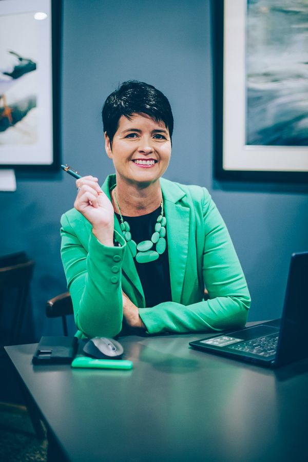 Kirsty Nancarrow as a journalist and author holding a pen and ready to write a story