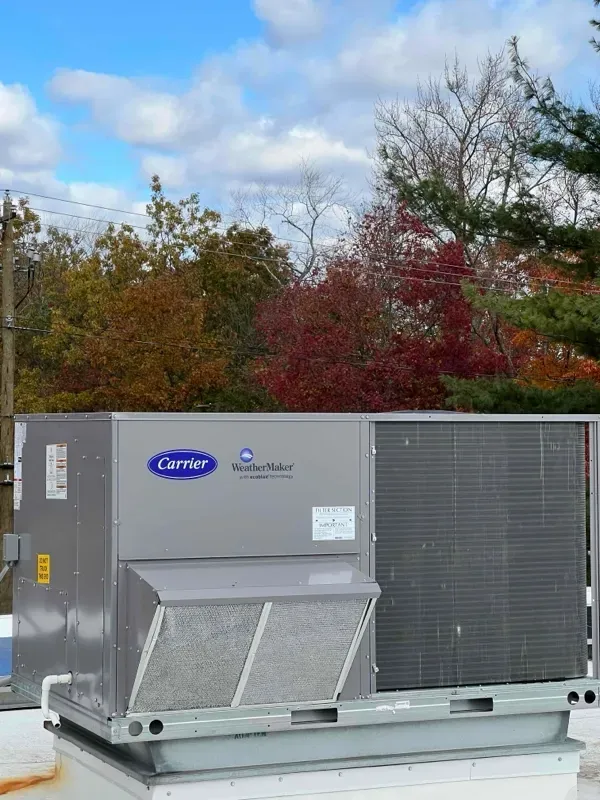 Installation of rooftop commercial Carrier HVAC unit