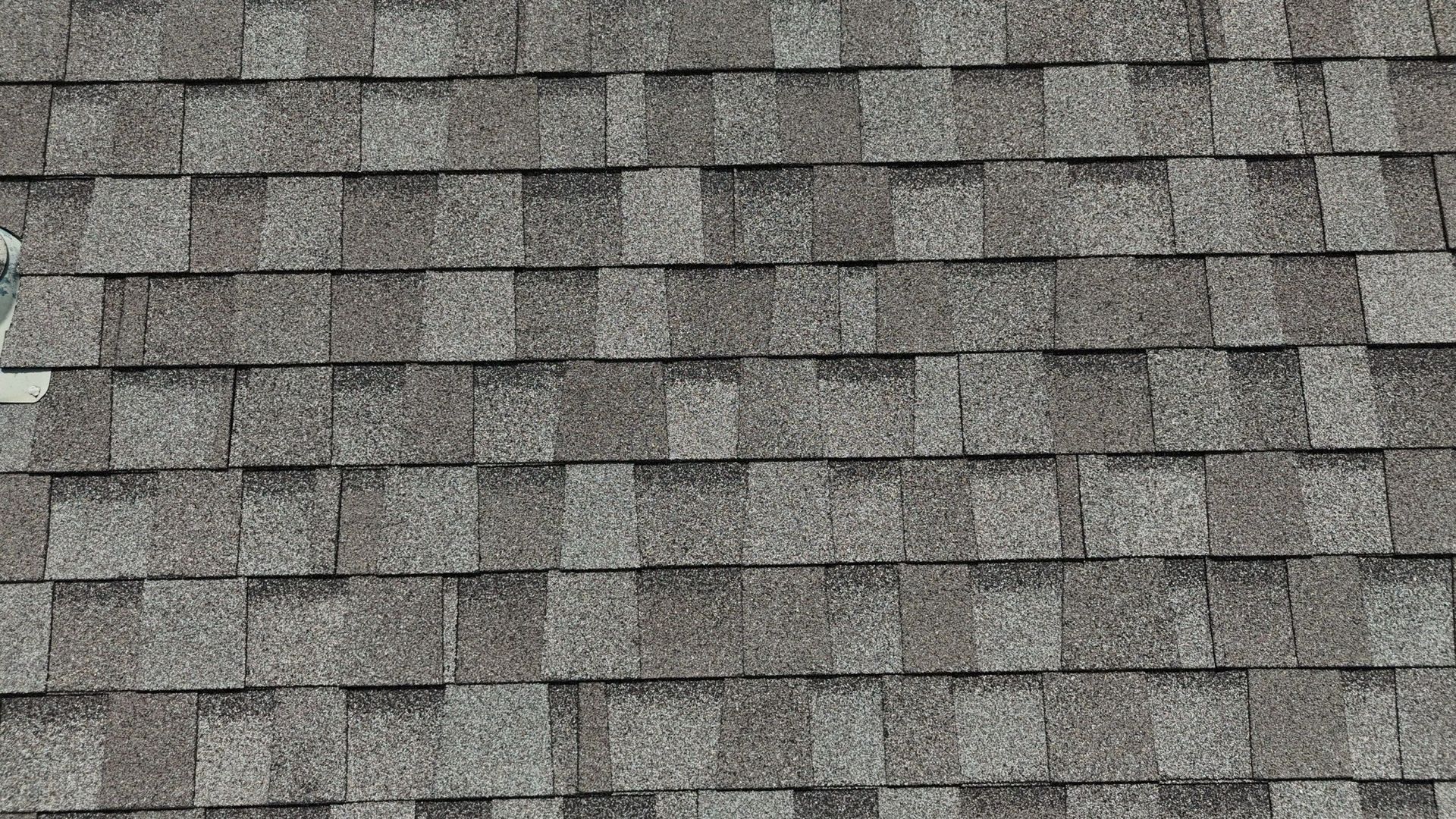 Gray asphalt shingle roof.