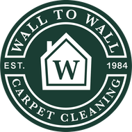 Wall To Wall Carpet Cleaning logo in green and white with a house and “W” emblem, est. 1984