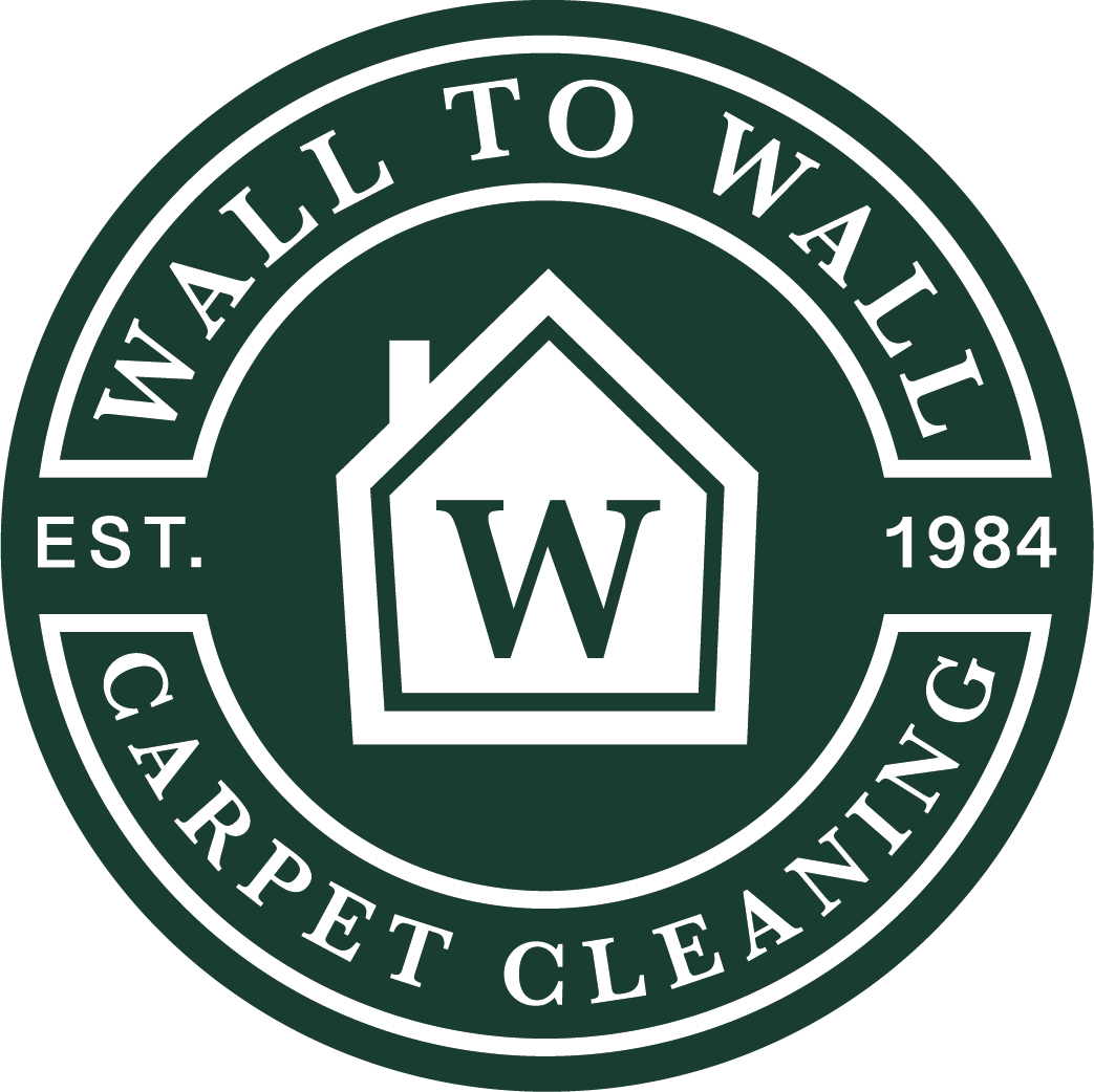 Wall To Wall Carpet Cleaning logo in green and white with a house and “W” emblem, est. 1984