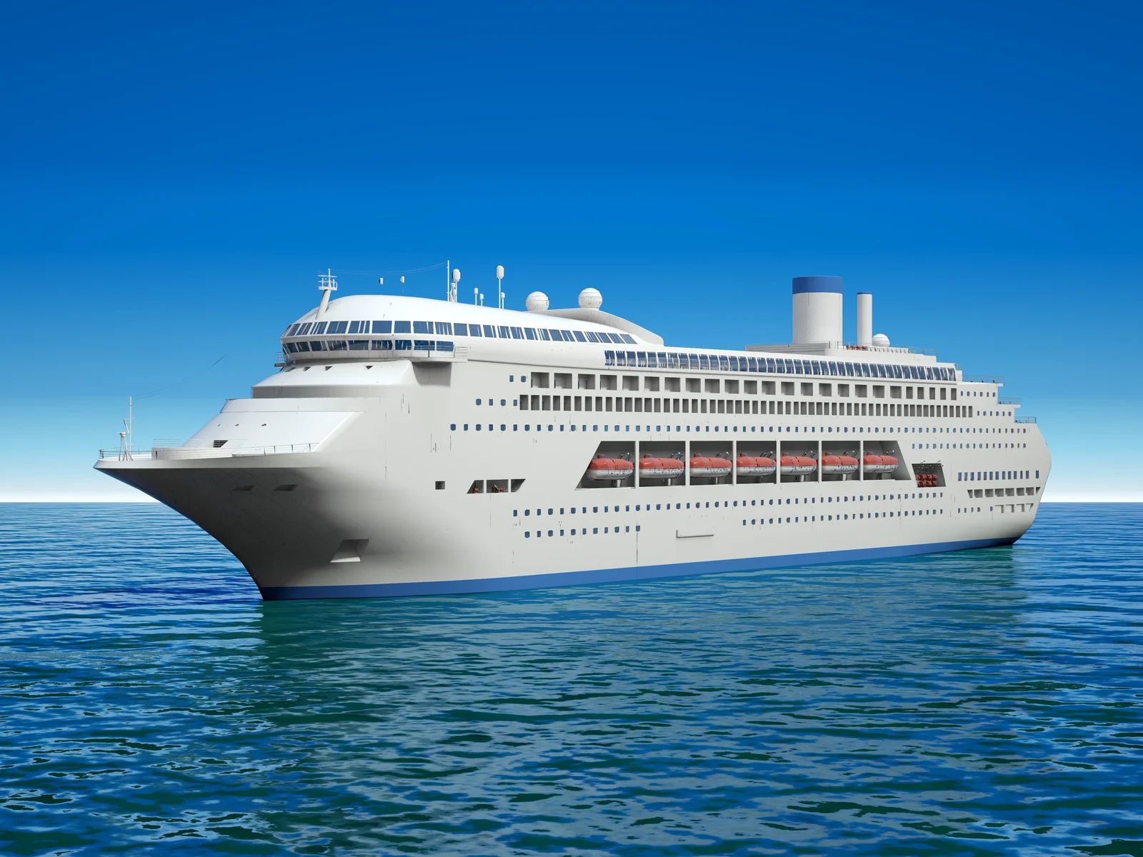 Large white cruise ship sailing on calm blue ocean under a clear sky