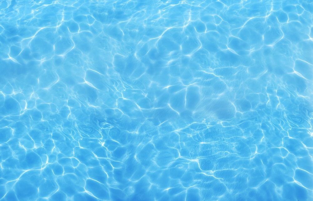 Clear, Light Blue Water With Shimmering Sunlight Reflections — Dean Thomas Pools in Mission Beach, QLD