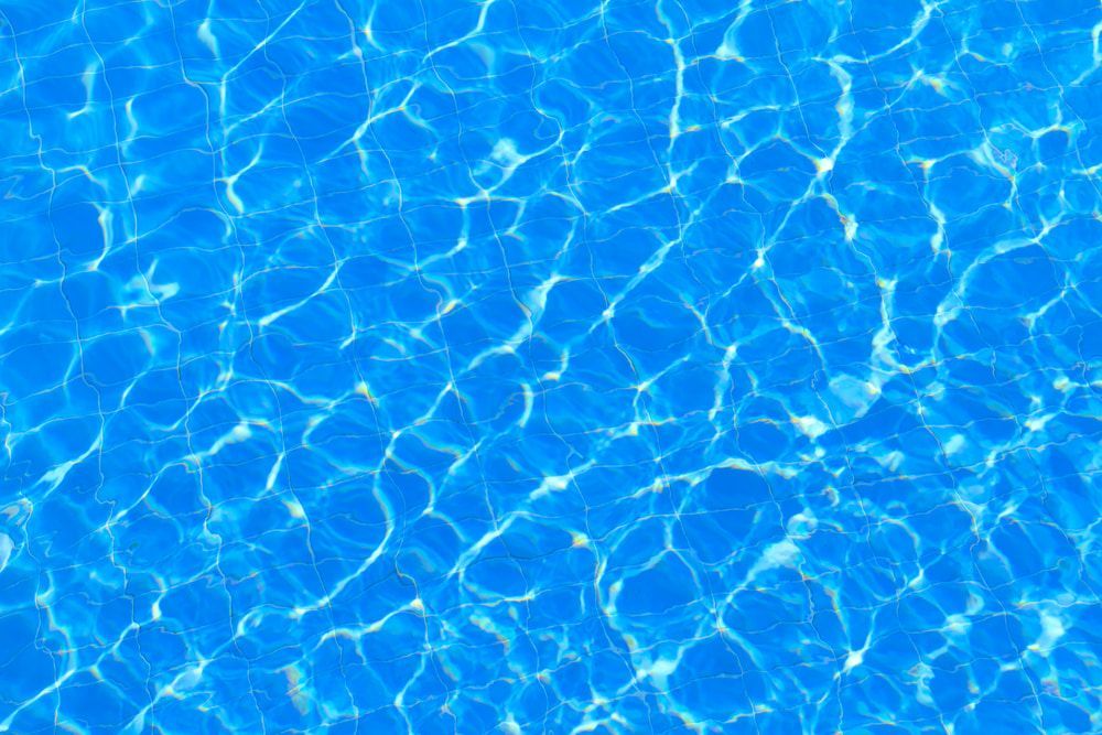 Bright Blue Water With Shimmering Light Patterns — Dean Thomas Pools in Manunda, QLD