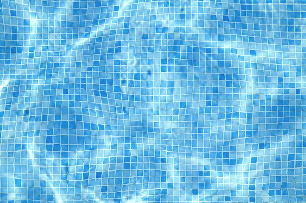Blue Water Ripples Over a Tiled Pool Bottom — Dean Thomas Pools in Manunda, QLD