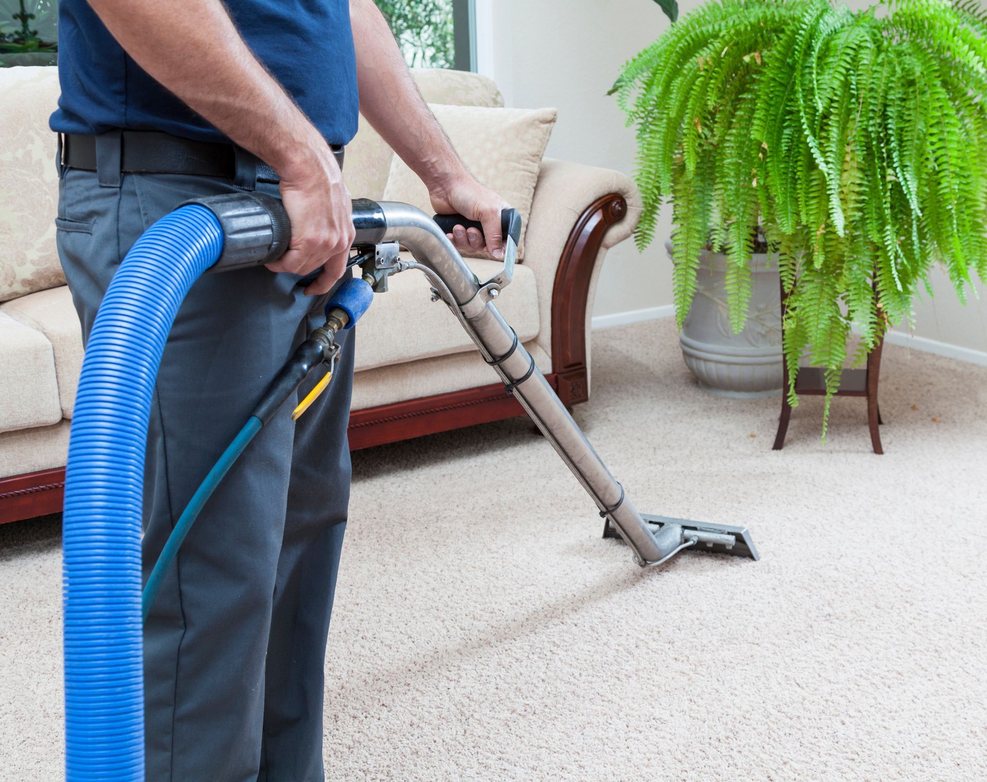 A Vacuum Cleaner Is Being Used To Clean A Carpet - Hudson, OH - Carpet Pro