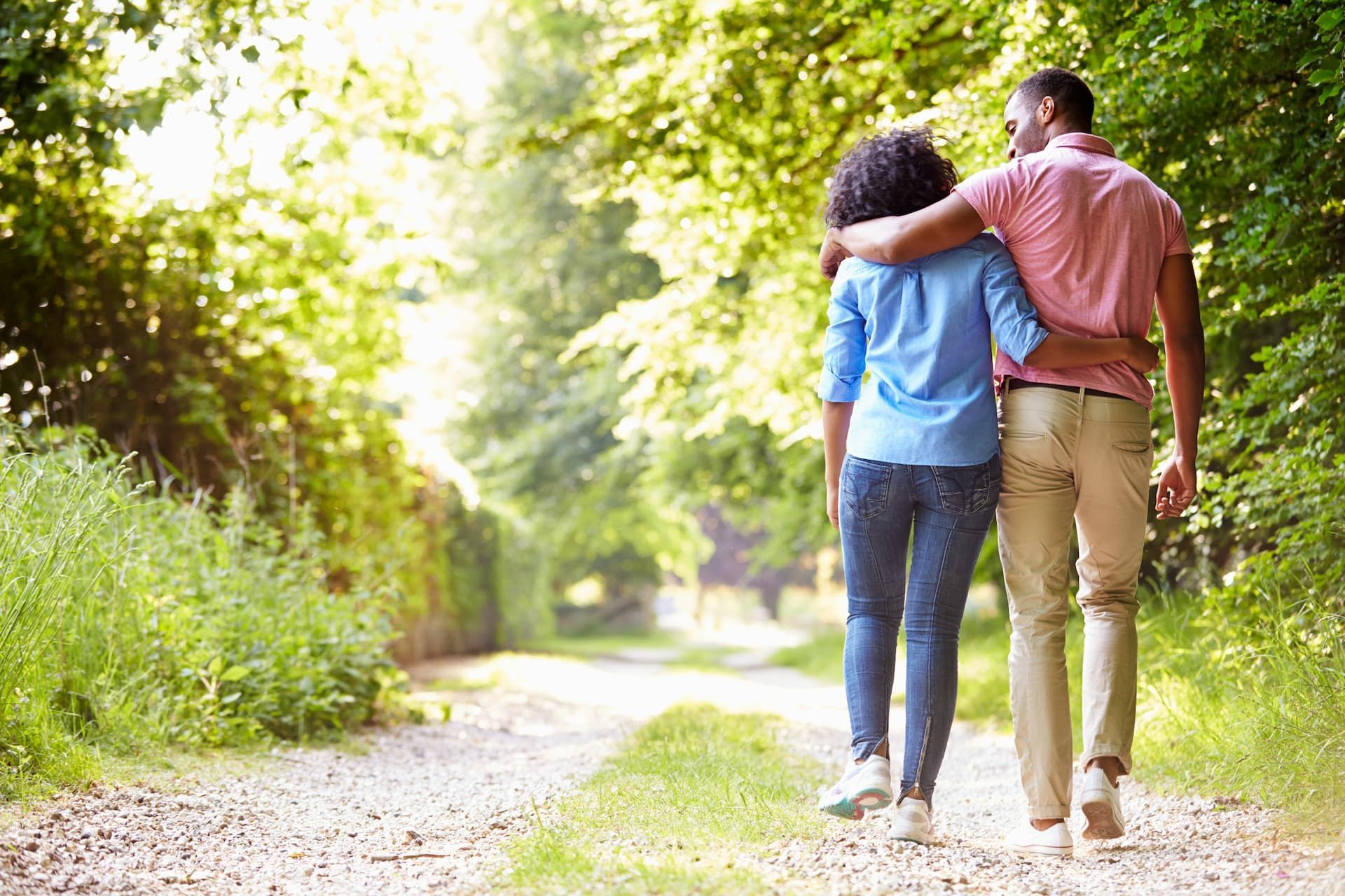 Couple walking down a path