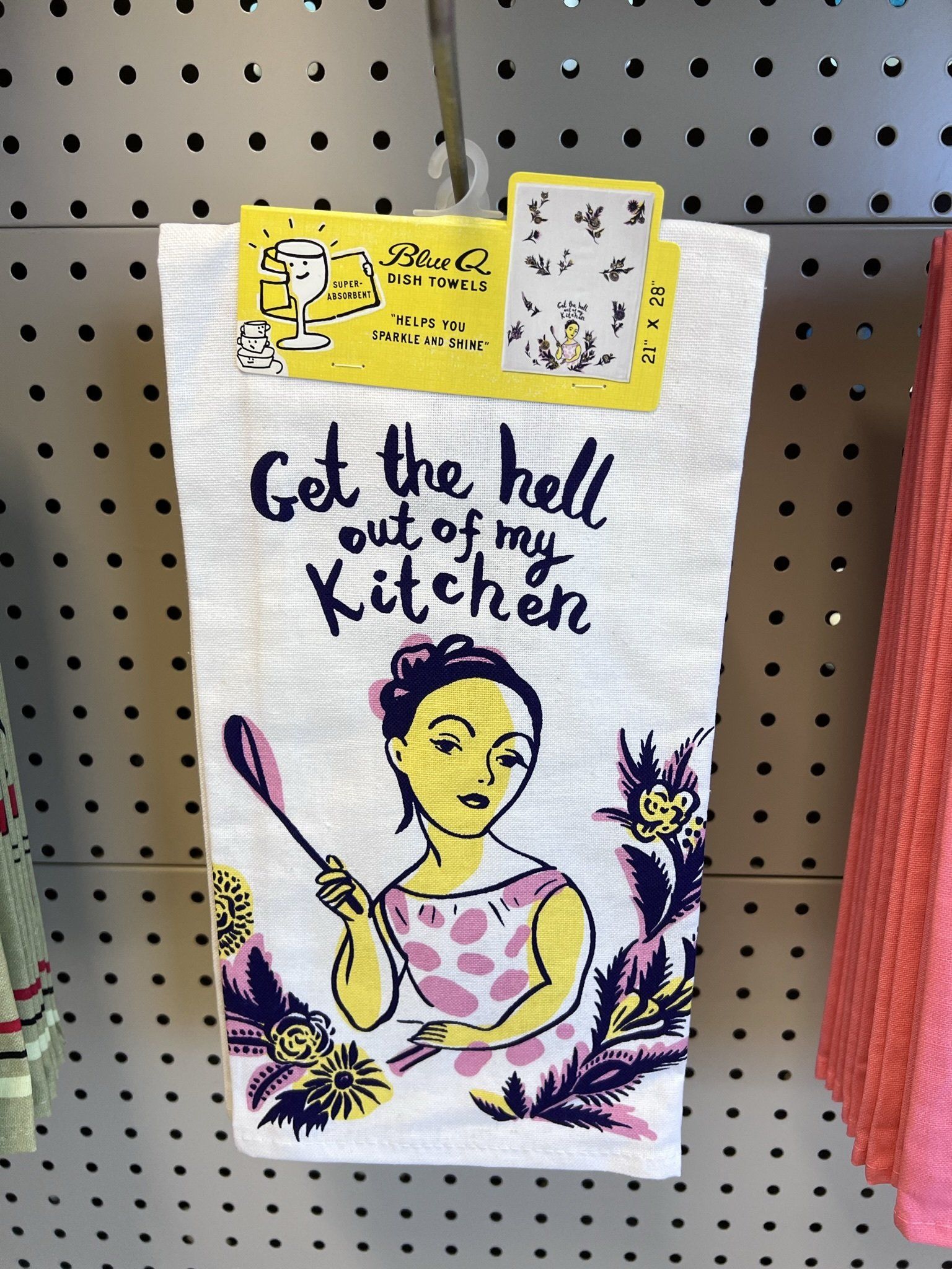 White kitchen towel with text 