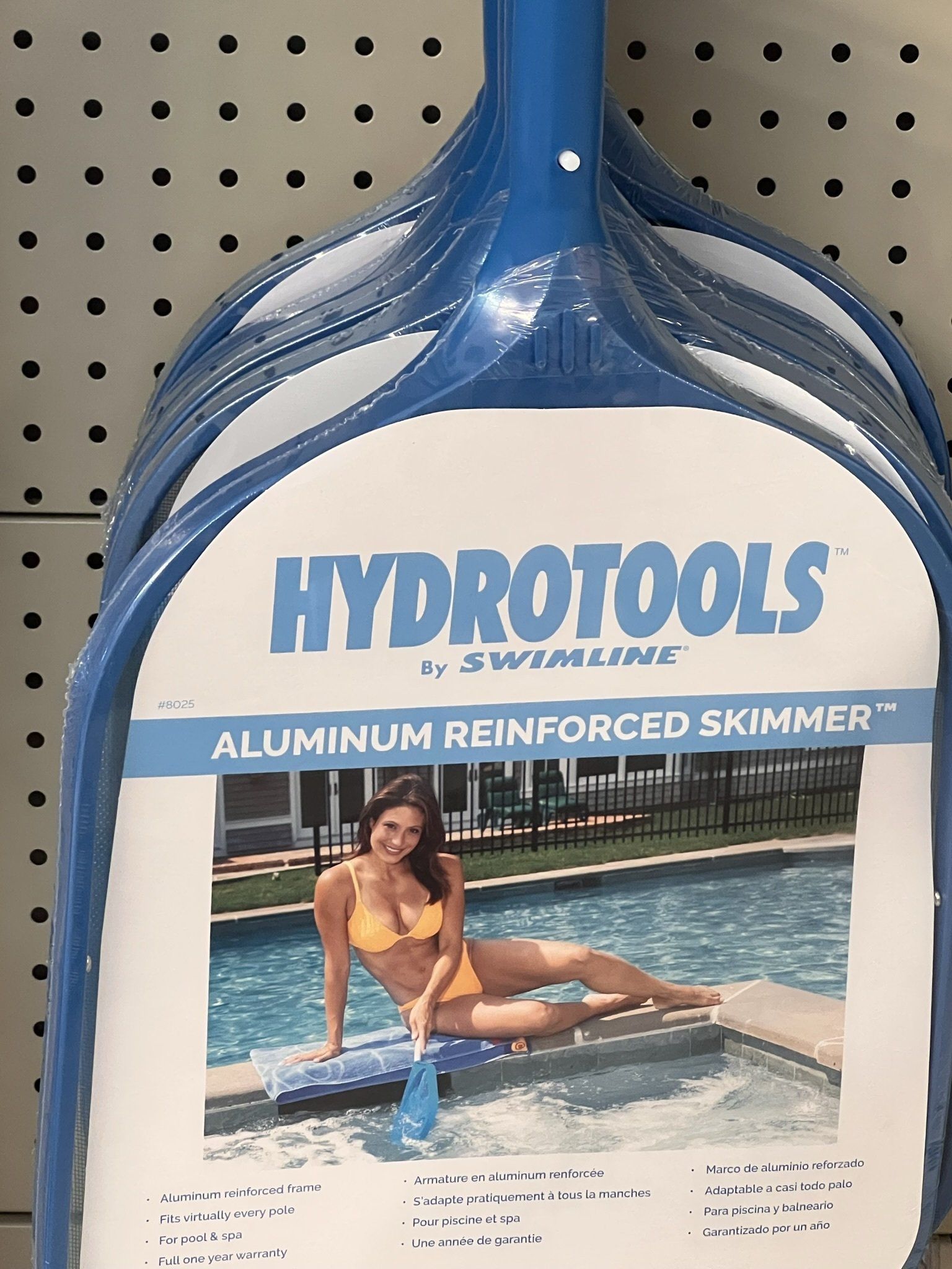 Blue Hydrotools pool skimmers stacked; woman in orange bikini poses with skimmer in pool.