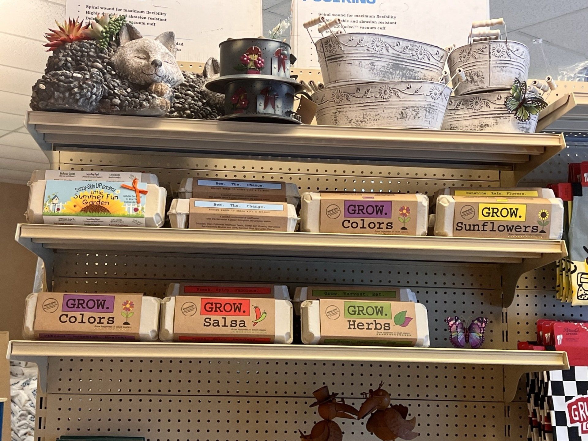 Shelves with gardening kits and planters.