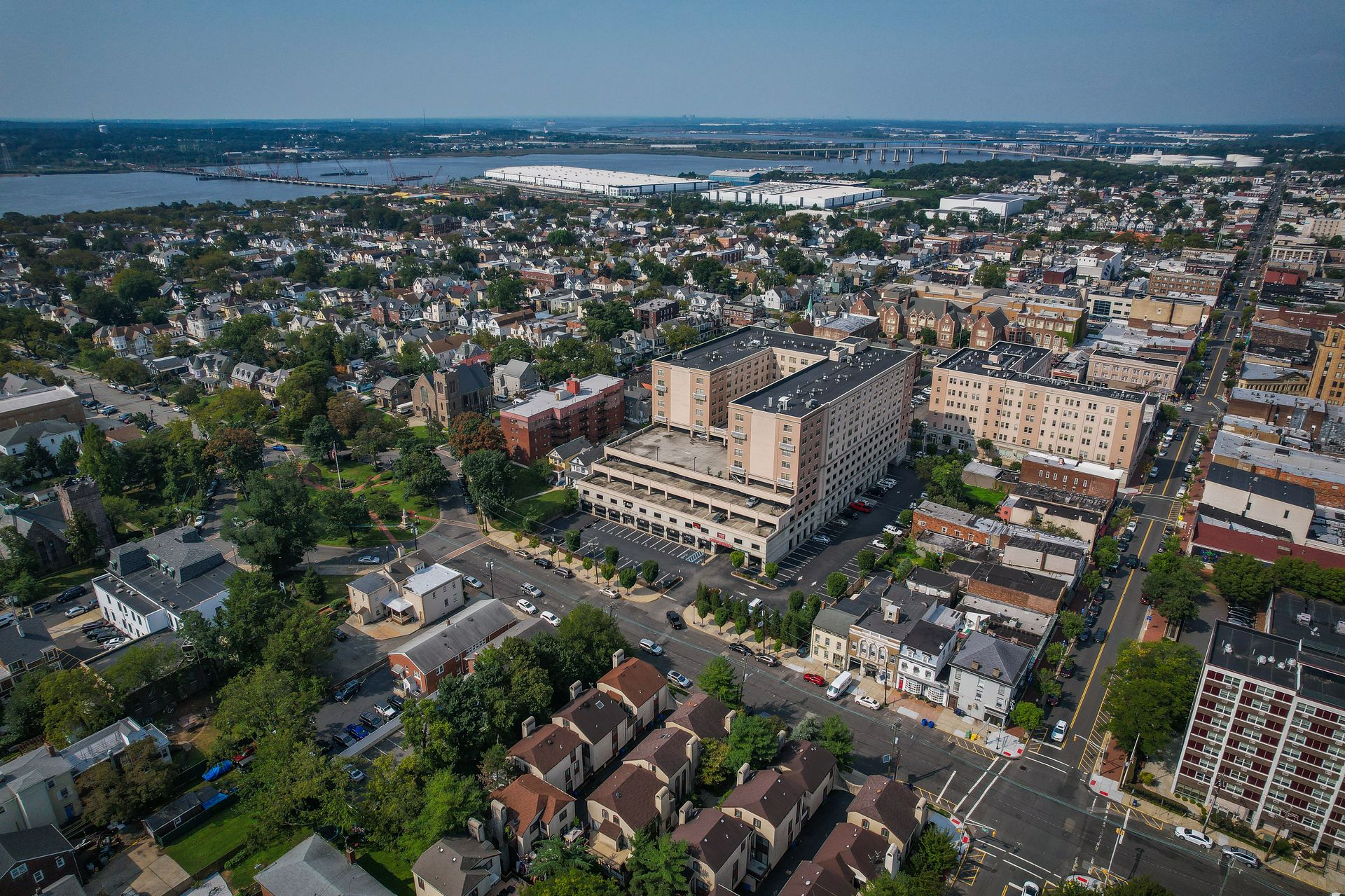 An aerial view of a city with a lot of buildings and trees.