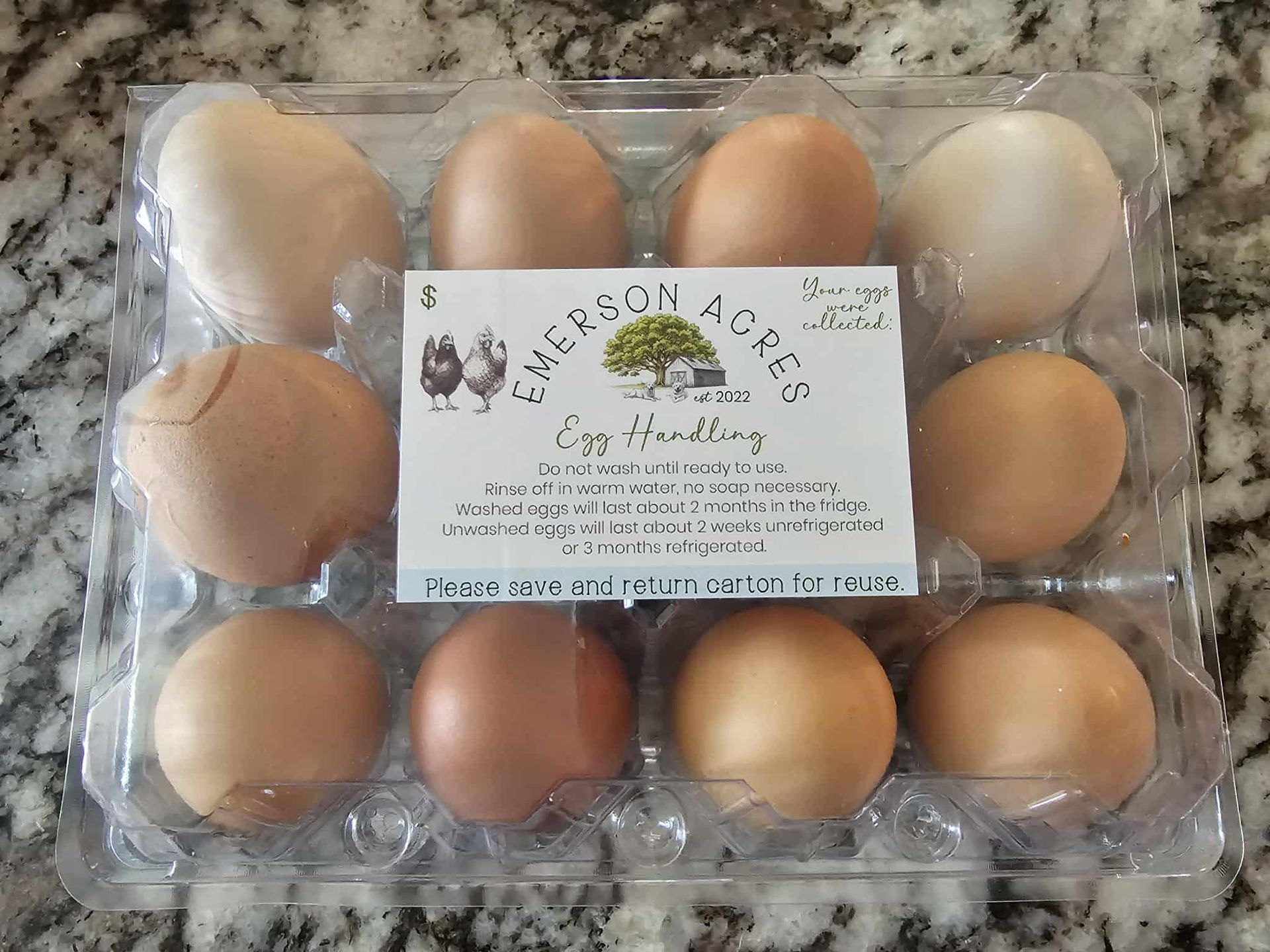 Emerson Acres farm egg carton label design with tree and barn illustration and egg handling instructions