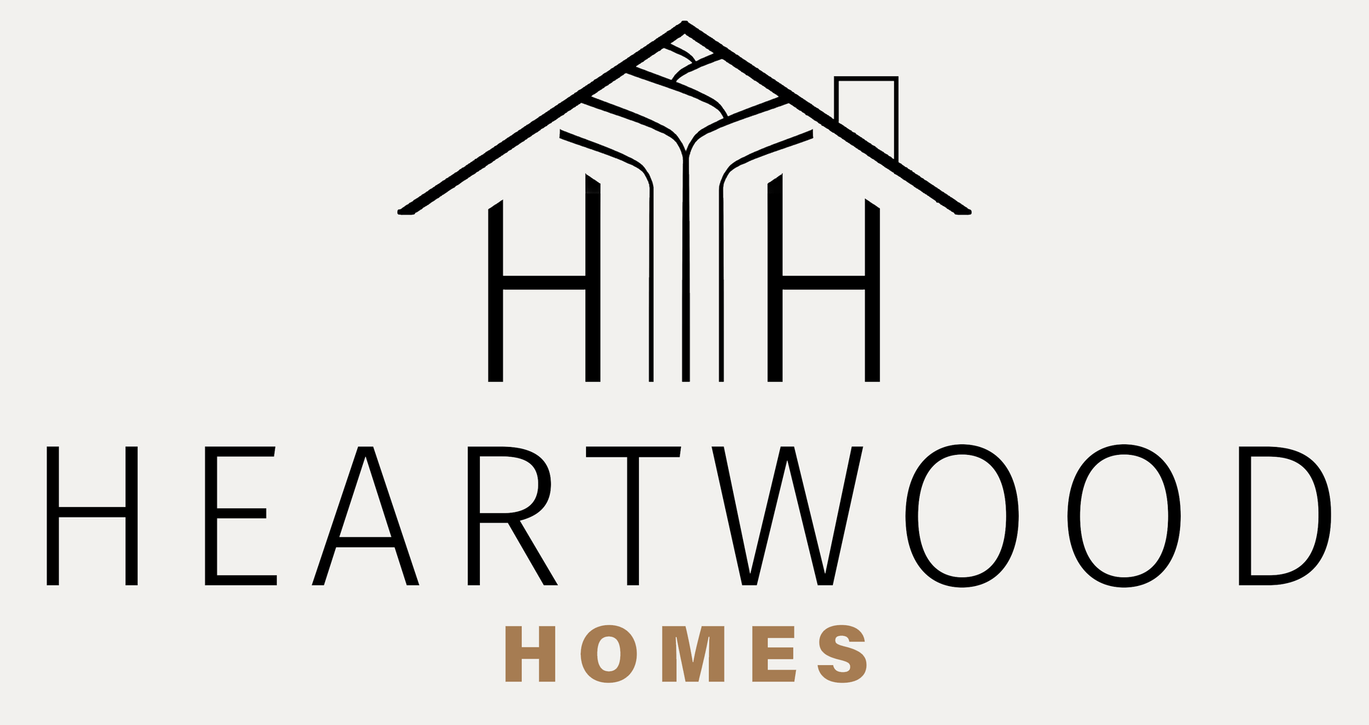 Heartwood Homes logo with a negative-space house and tree design for a real estate brand