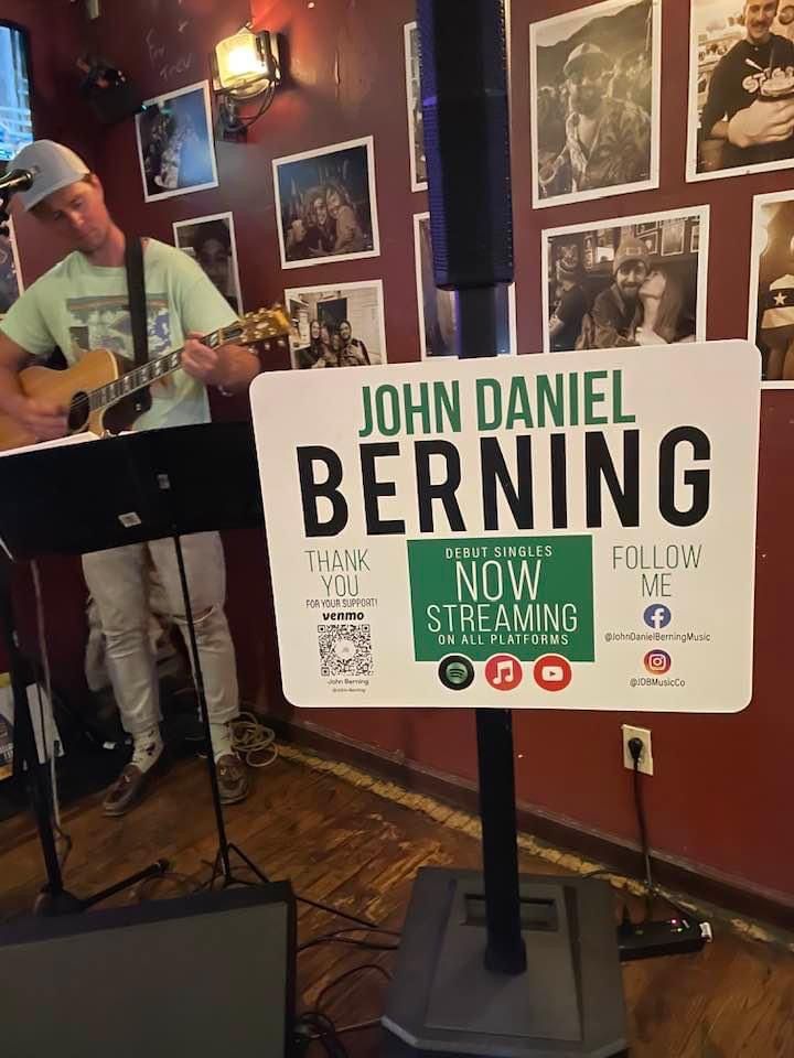 Custom event signage design for musician John Daniel Berning, featuring streaming and social media info
