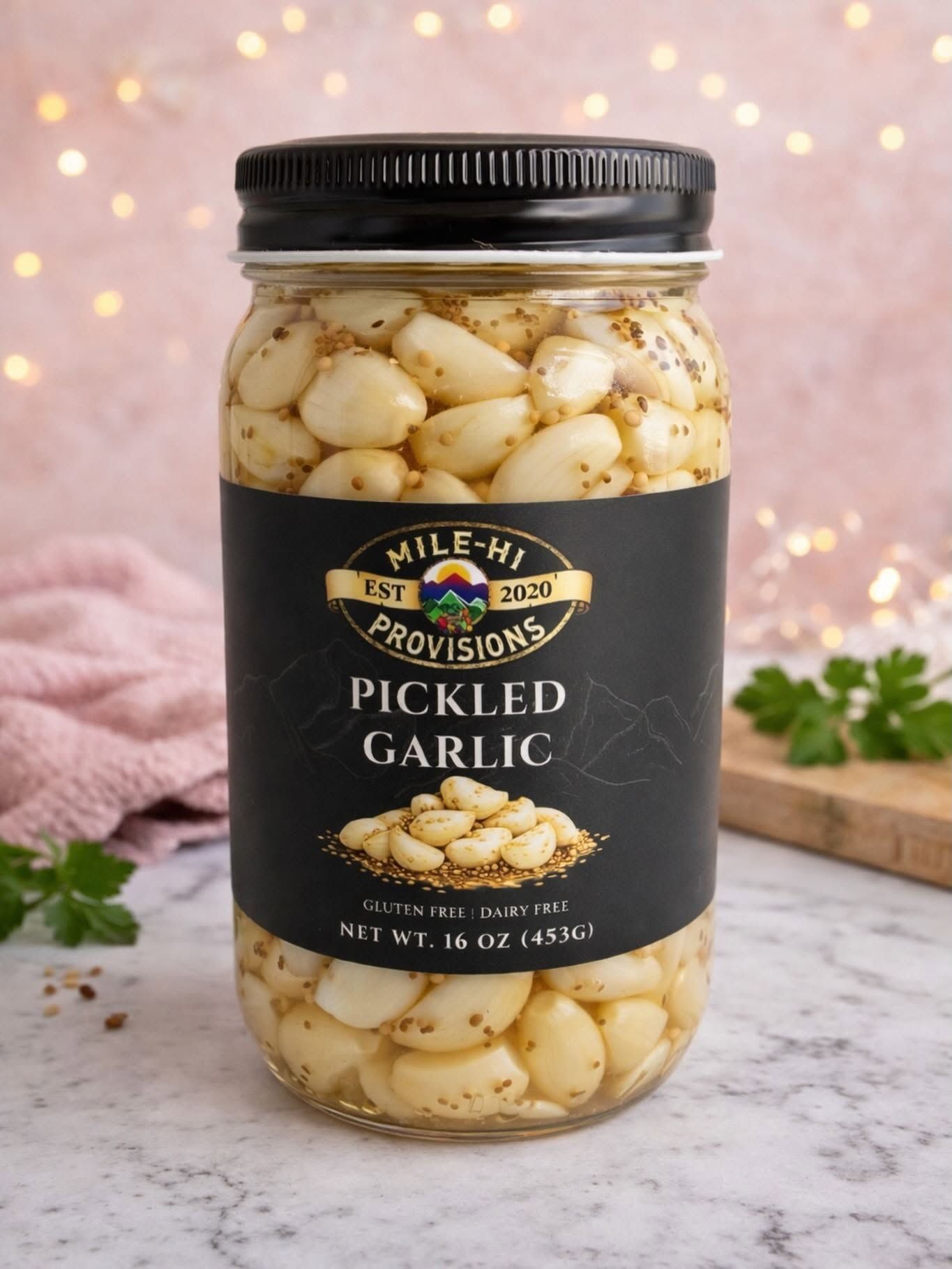 Pickled garlic jar label design for Mile-Hi Provisions, featuring gold mountain branding on a black background