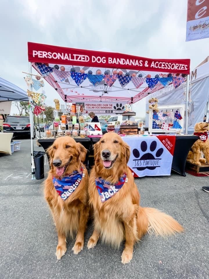Vendor booth design with red tent banner, patriotic bunting, and paw print tablecloth 