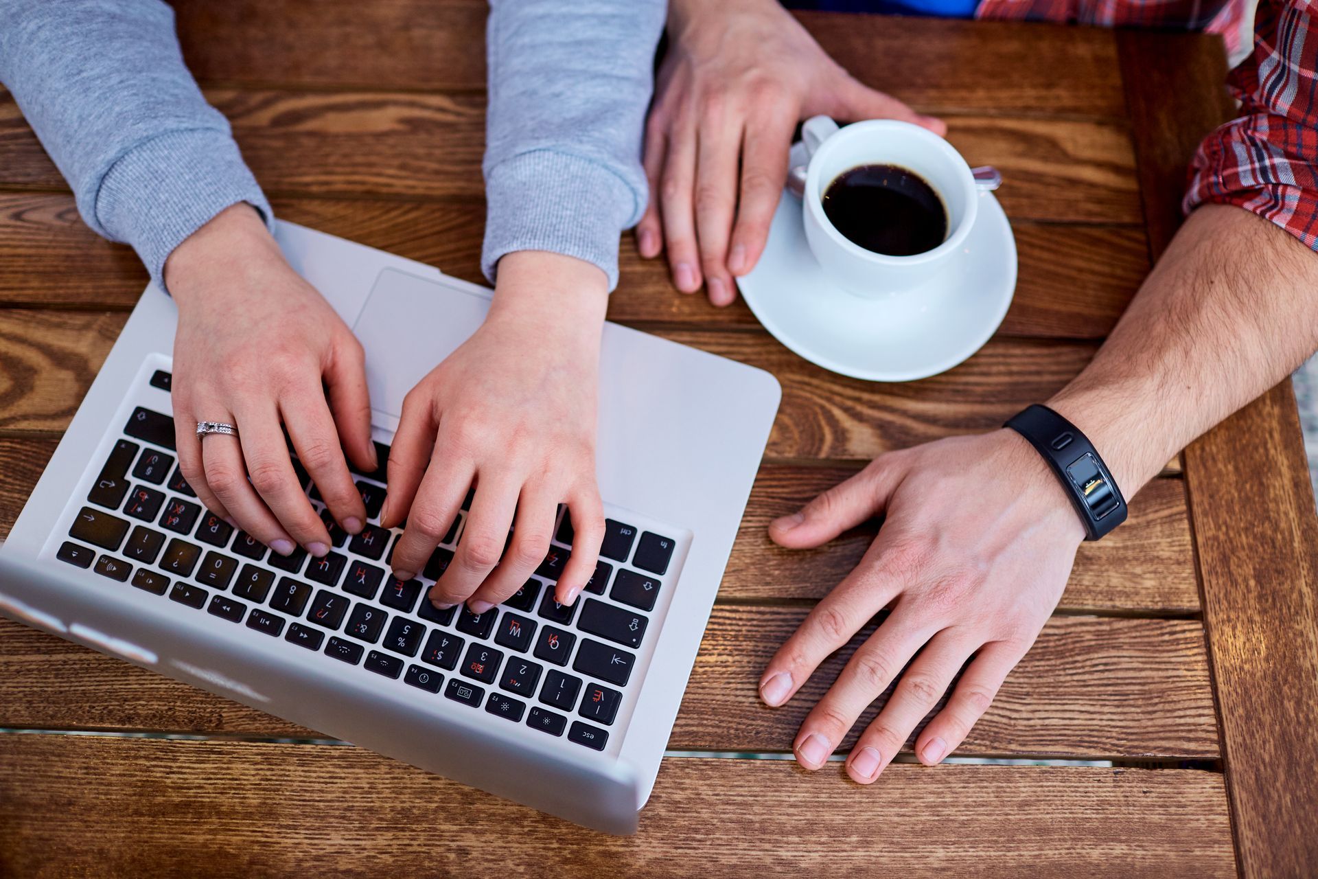 Your first impression, online Close-up of hands typing on a laptop keyboard