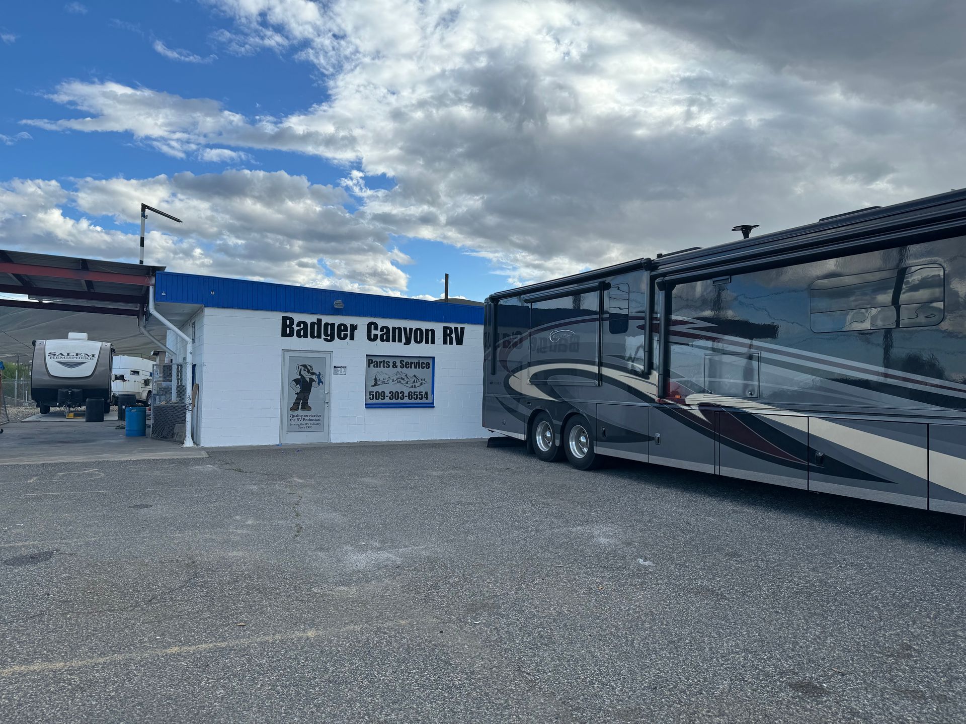 RV parked next to a building labeled 