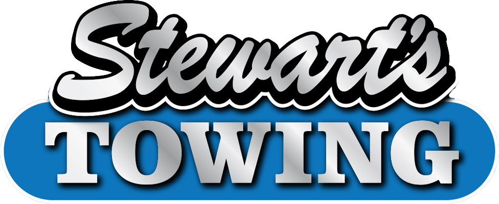 Stewart's Towing logo with silver text and a blue oval.