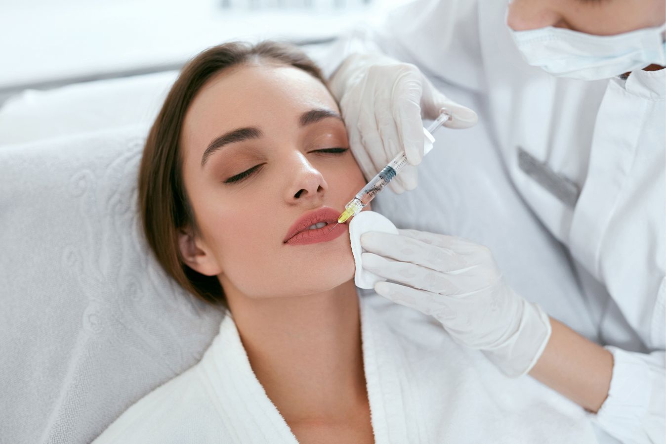Patient getting lip filler injections at Z Aesthetic Dermatology in Baton Rouge