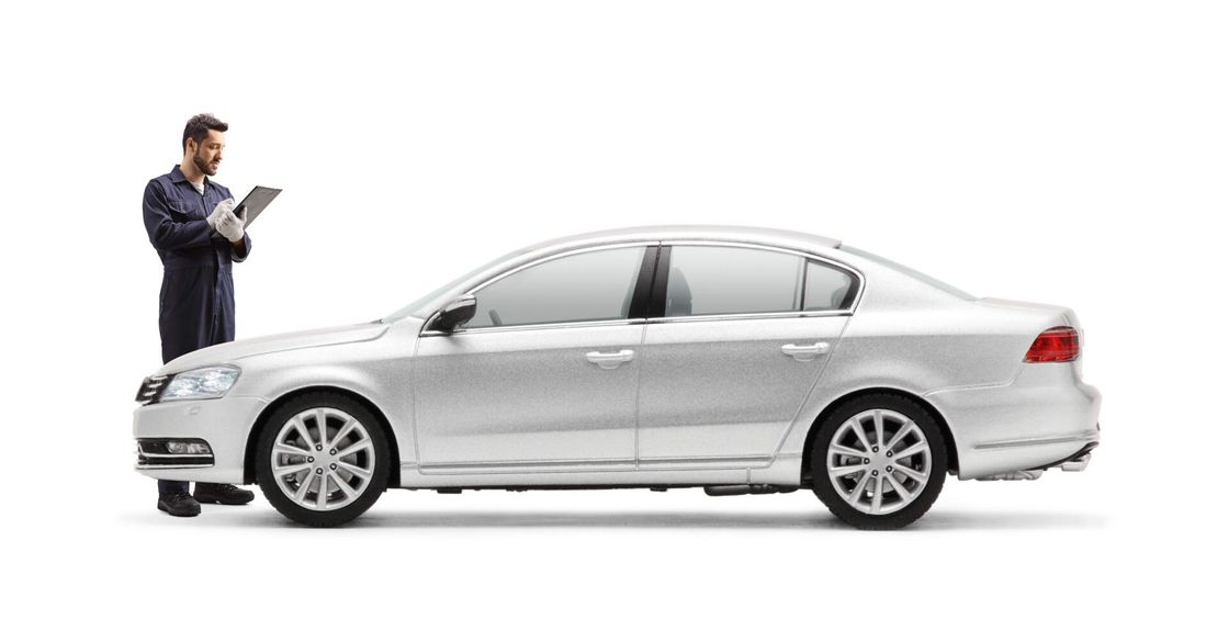 Mechanic diagnosing car