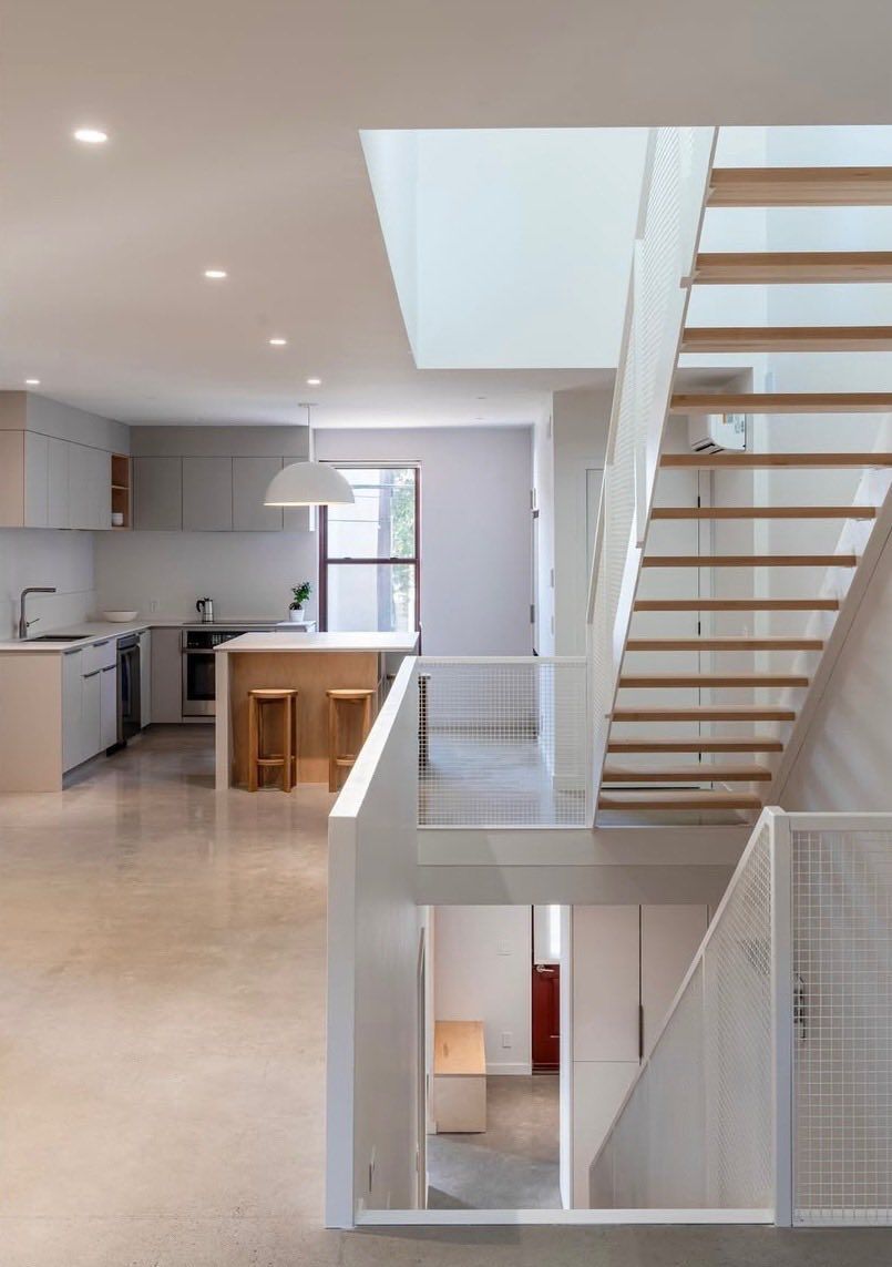 There is a staircase leading up to the second floor of a house.