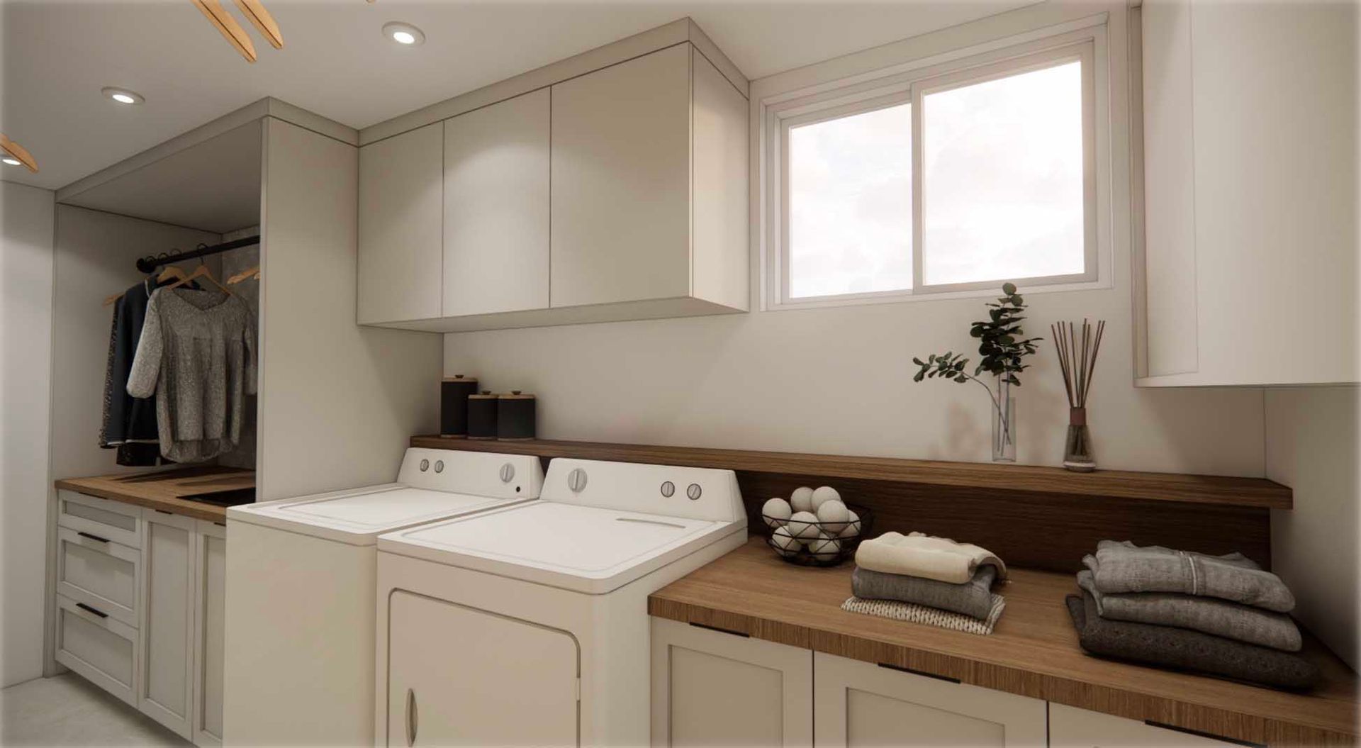 A laundry room with a washer and dryer and a window.