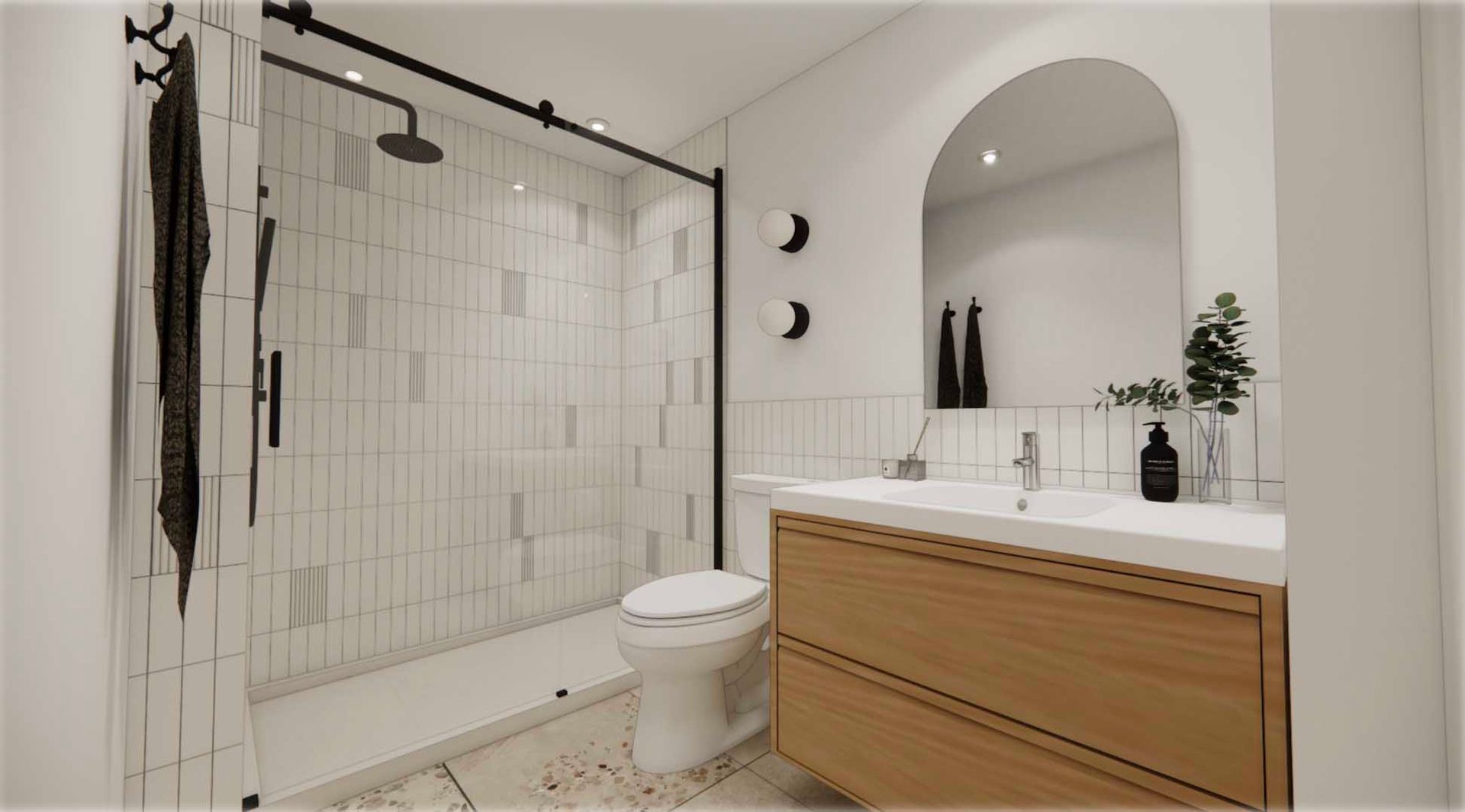 A bathroom with a toilet , sink , shower and mirror.