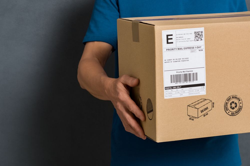A Cardboard Box With a Shipping Label — The Move It Man In Mission Beach, QLD