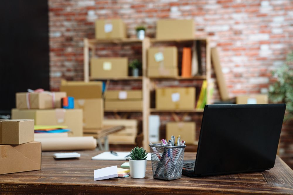 Desk With Laptop, Cardboard Boxes, and Packing Supplies — The Move It Man In Cairns, QLD