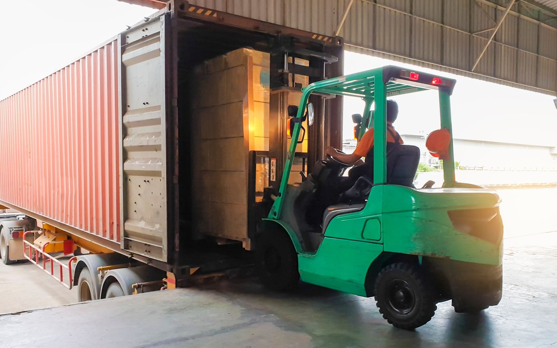 Forklift Loading Cargo Into a Shipping Container — The Move It Man In Tablelands, QLD