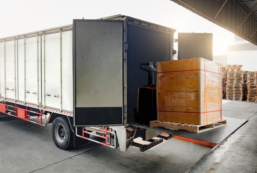 Truck at Loading Dock, Open Door With Pallet of Boxes, Forklift — The Move It Man In Tablelands, QLD
