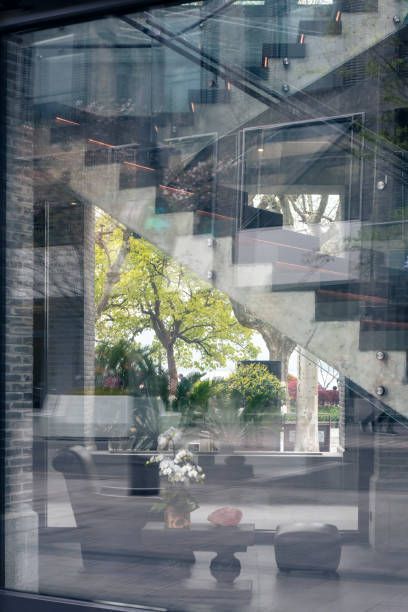 A reflection of a staircase in a glass window.