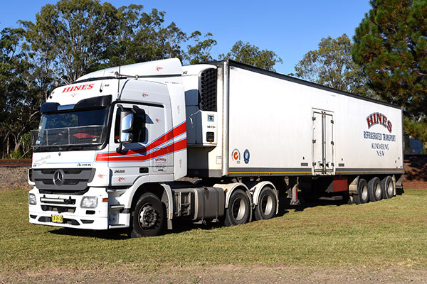 White Refrigerated Hines Transport Truck on Grass — Hines Logistic Pty Ltd In Kundabung, NSW