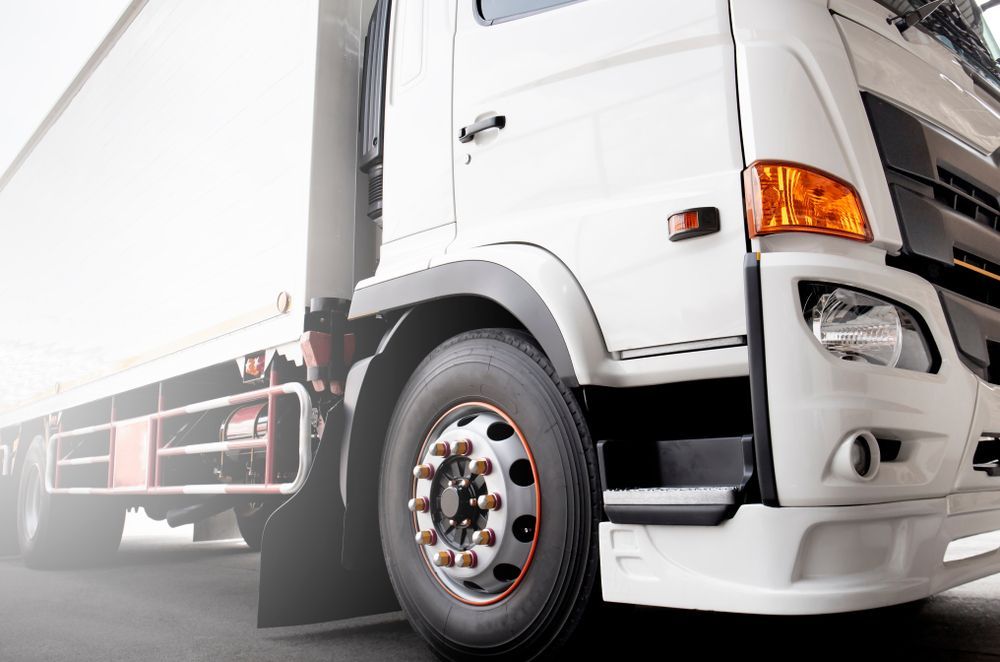 White Semi-truck, Close-up View of the Front Tire and Cab — Hines Logistic Pty Ltd In Tamworth, NSW