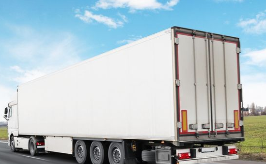 White Semi-truck Driving on a Highway — Hines Logistic Pty Ltd In Kempsey, NSW