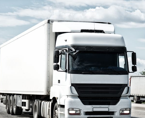 White Semi-truck Driving on a Highway, Hauling a Large Trailer — Hines Logistic Pty Ltd In Tamworth, NSW