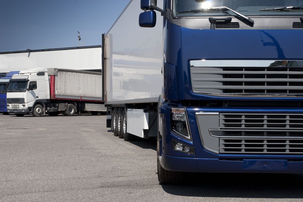 Blue Semi-truck Parked Next to a White Trailer — Hines Logistic Pty Ltd In Sydney, NSW