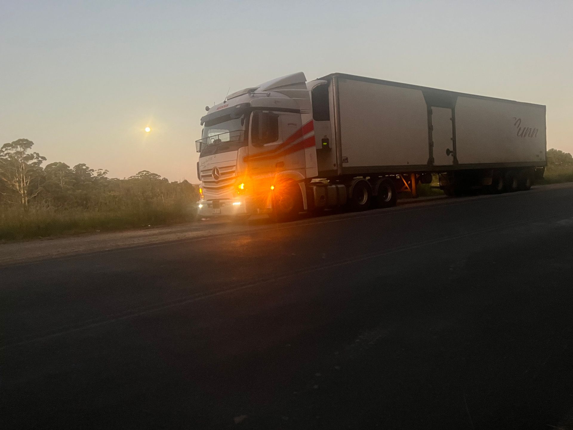 Semi-Truck Parked on the Side of a Road Under a Twilight Sky — Hines Logistic Pty Ltd In Kundabung, NSW