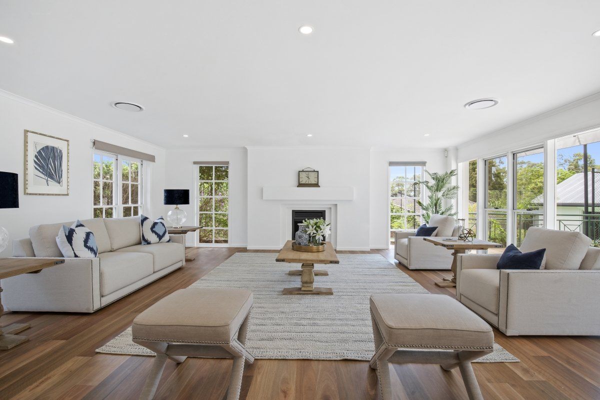 A living room filled with furniture and a fireplace