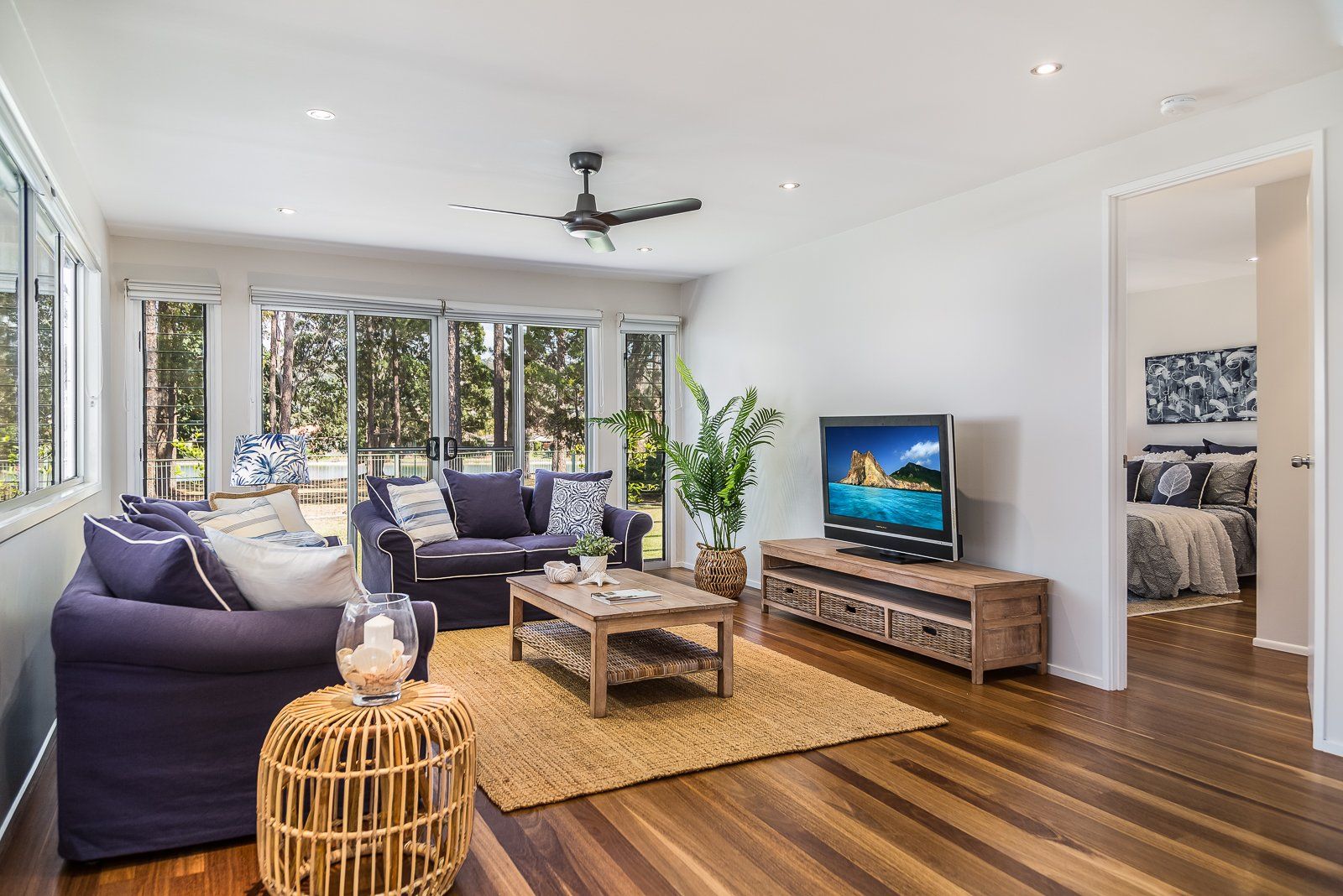 A living room filled with furniture and a flat screen tv.
