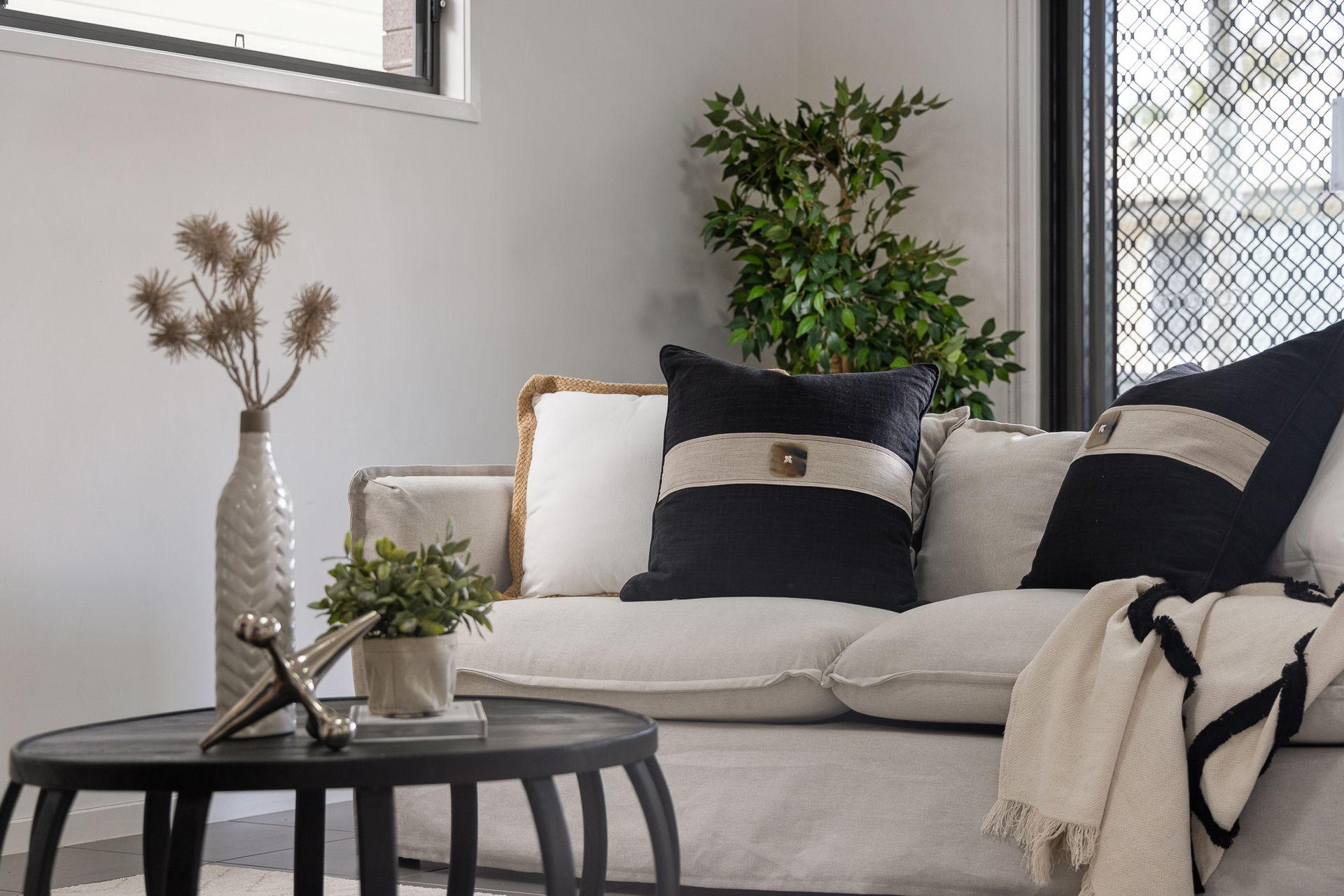 A living room with a couch and a coffee table.