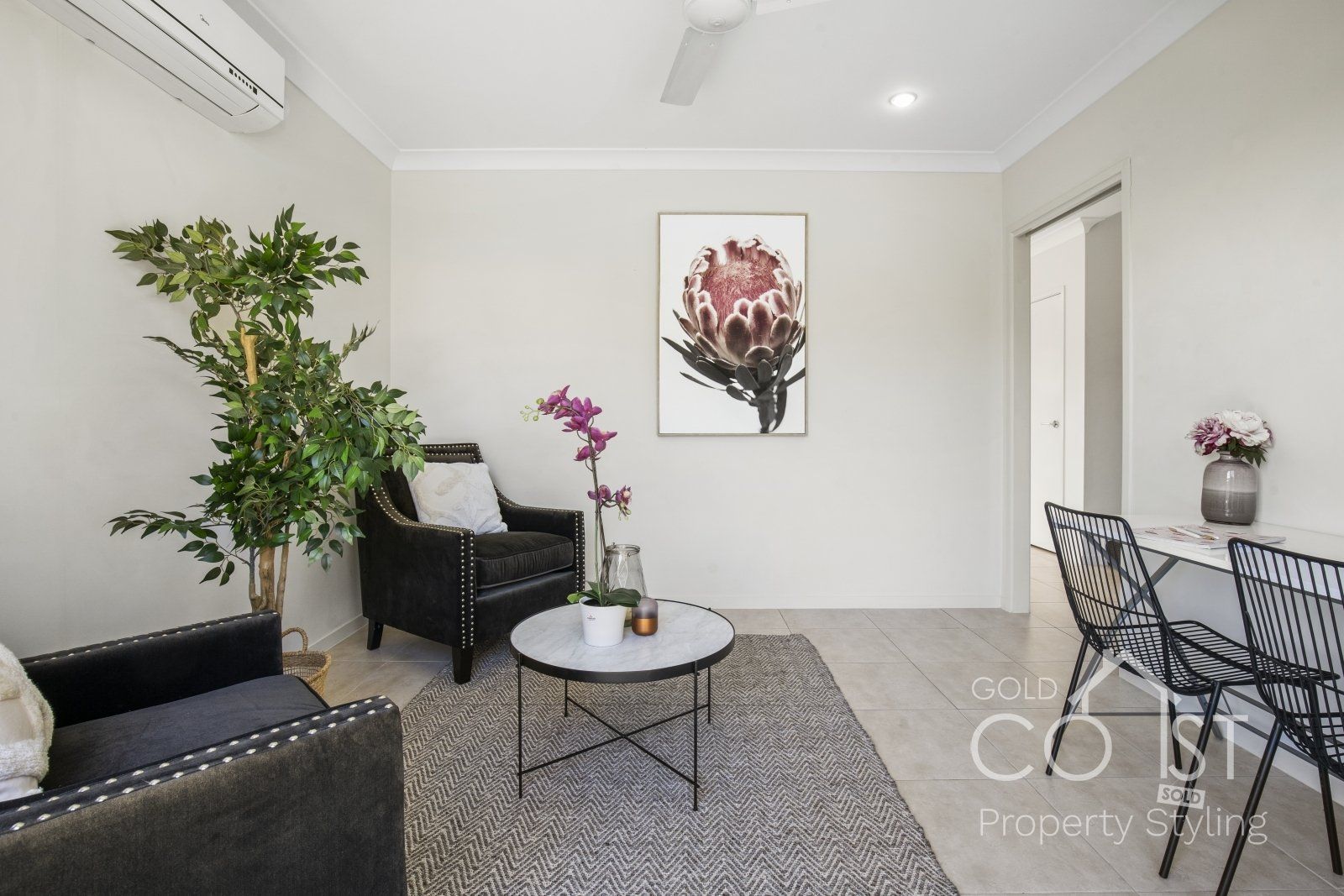 A living room with two chairs and a coffee table