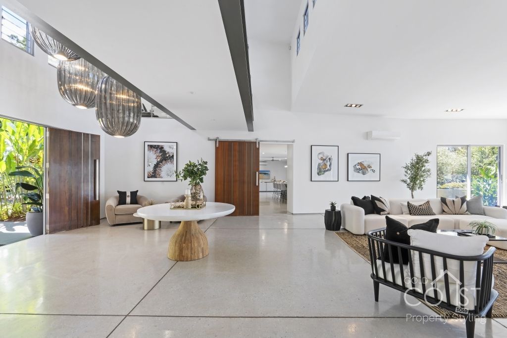 A living room with a lot of furniture and a table