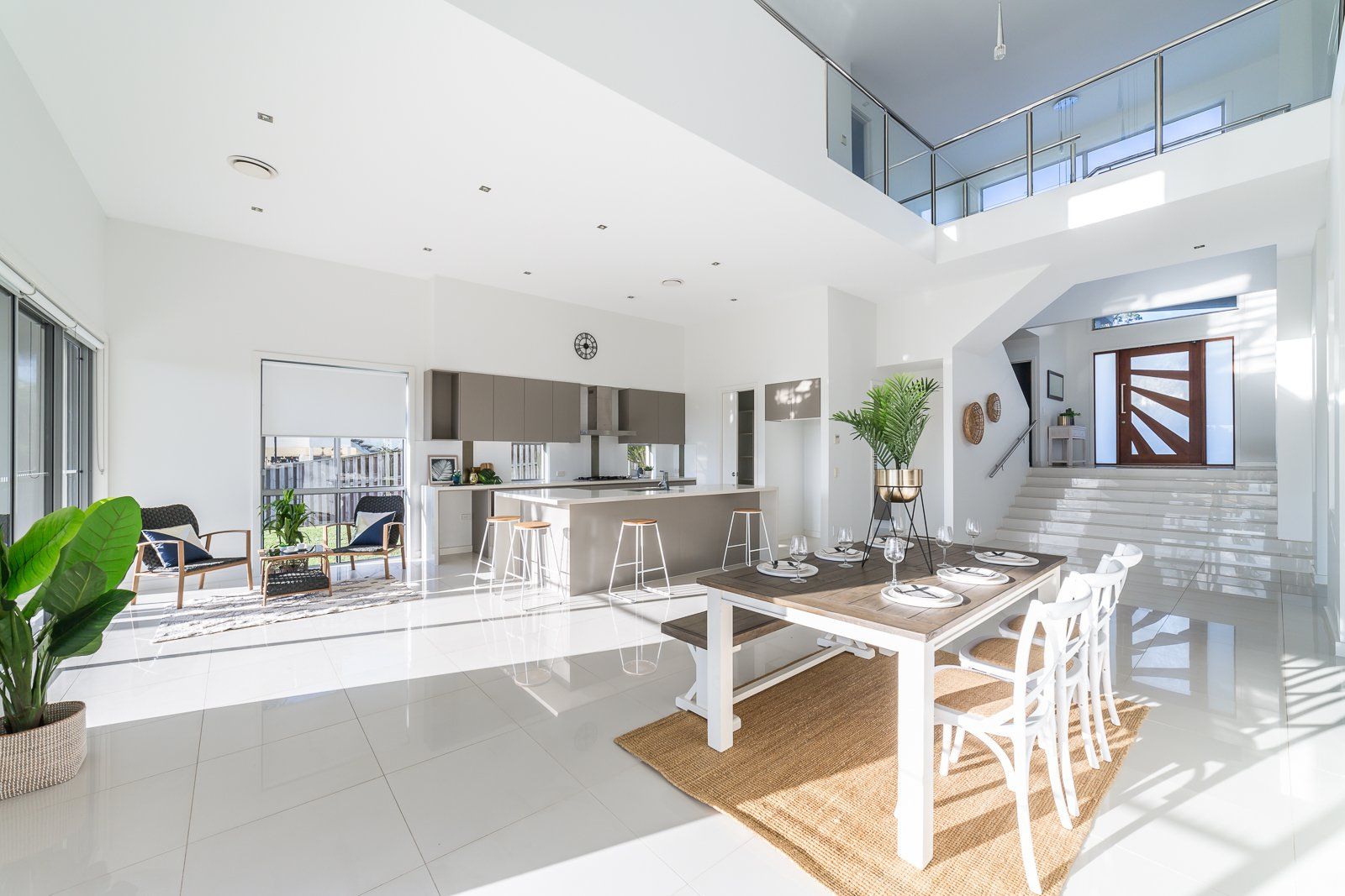 There is a dining table and chairs in the middle of the room.