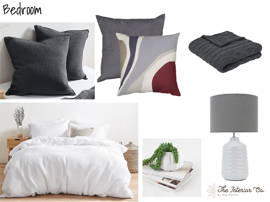 A bedroom with a bed , pillows , blankets and a lamp