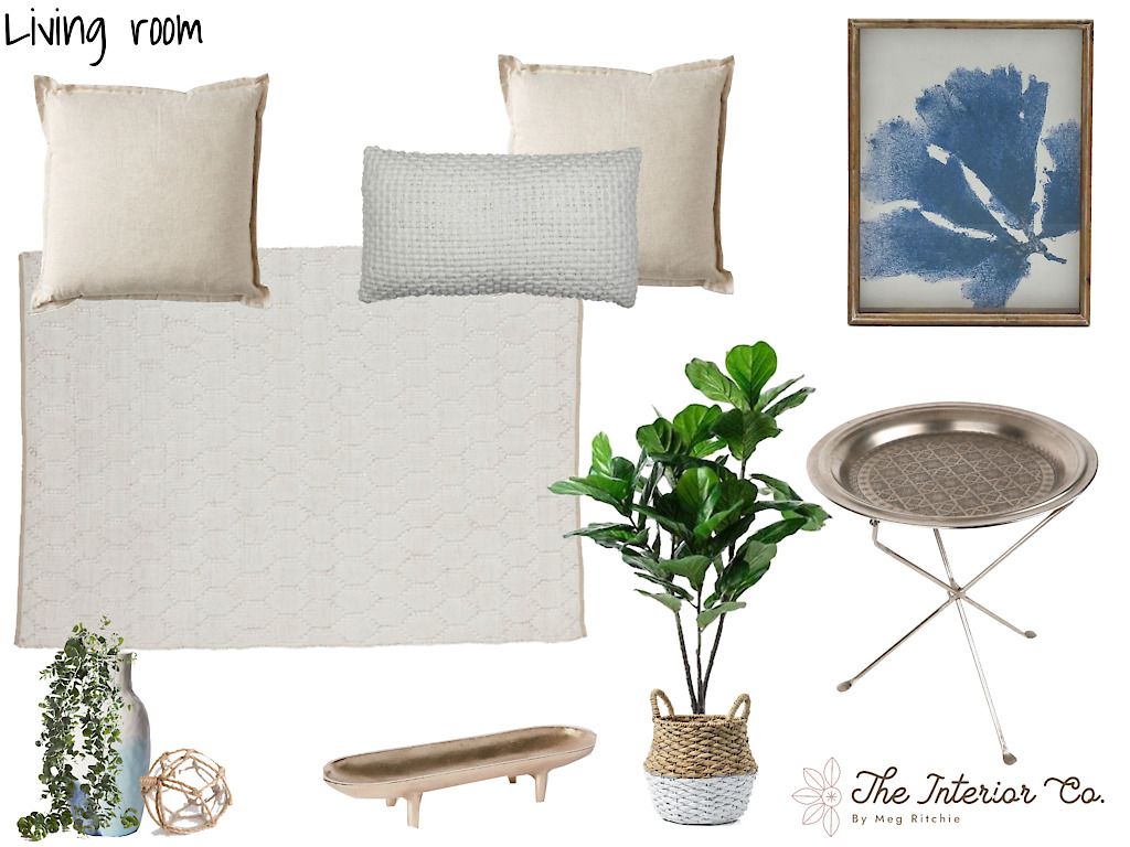 A living room with pillows a plant and a tray