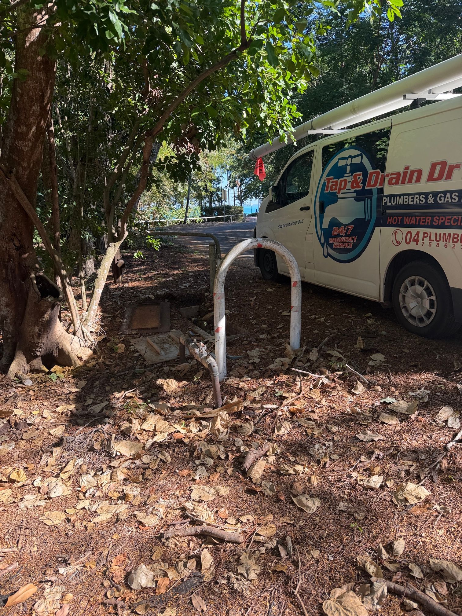 Person Standing in Muddy Hole, Copper Pipe Visible — Tap & Drain Doctor NT in Winnellie, NT
