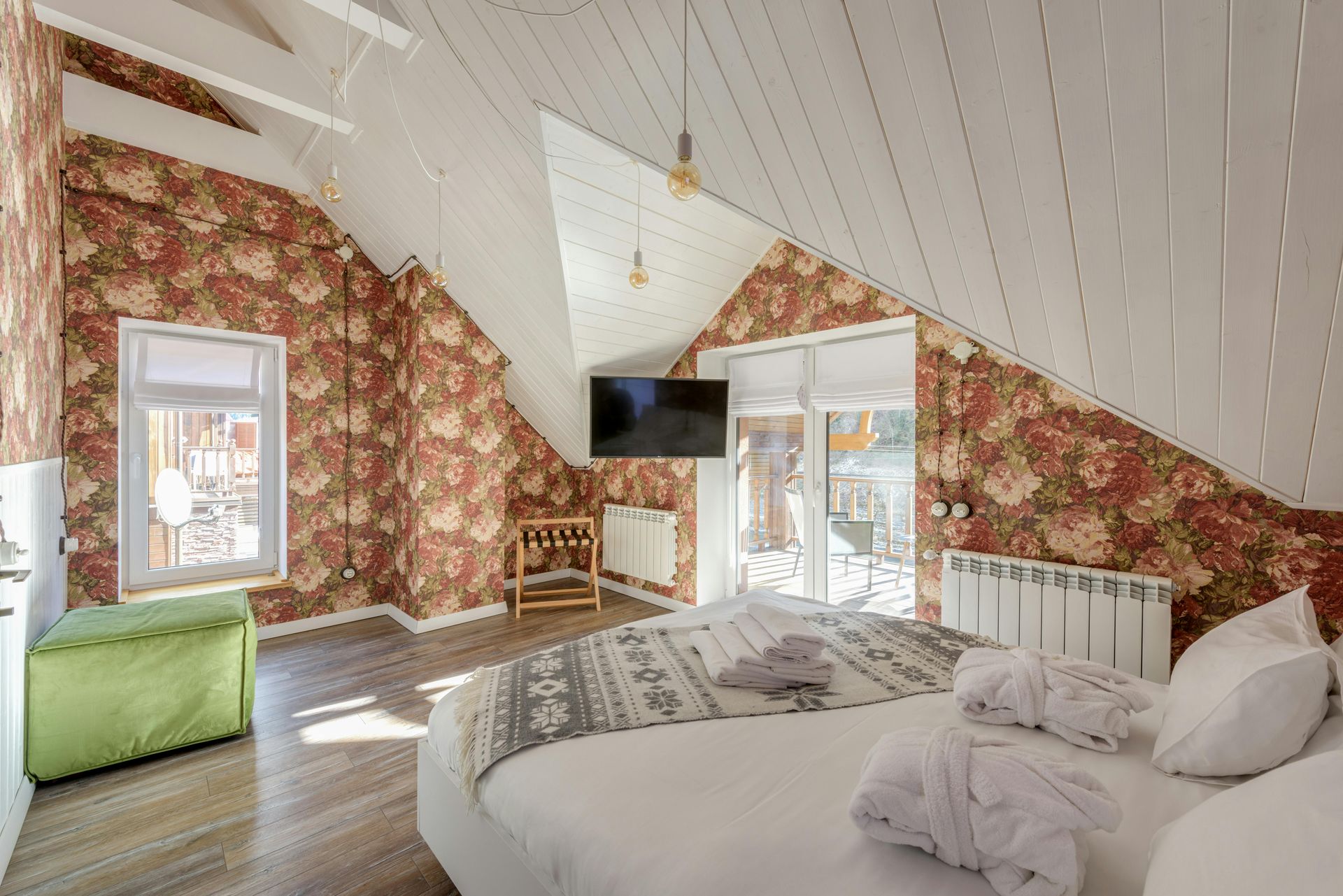 Winnie the Pooh themed bedroom with painted trees, characters, and blue sky background. Brown carpet, ceiling fan, and windows.